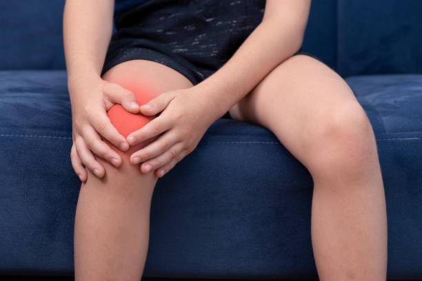 Child With Knee pain stock photo