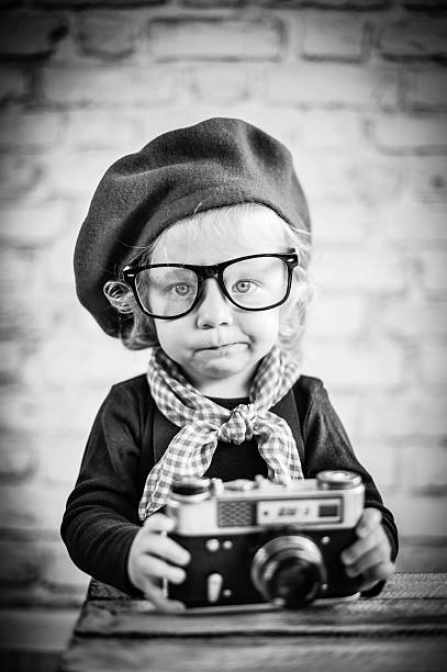 Child with vintage camera stock photo