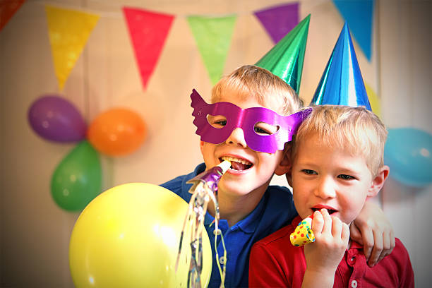 Children Celebrating a Birthday Party at Home stock photo