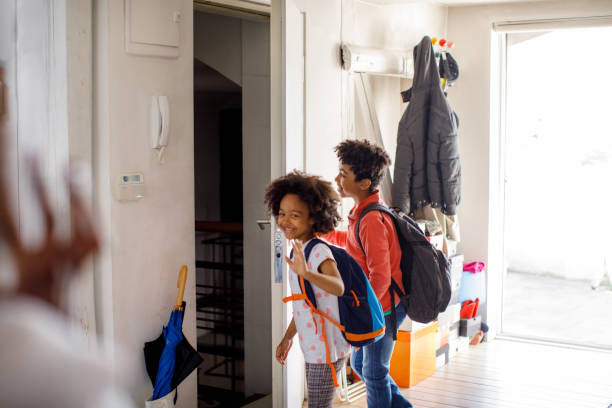 Children Getting Ready To Leave House For School stock photo
