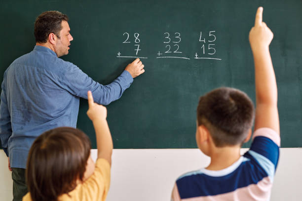 Children learning mathematic at classroom on school building. Education Children learning mathematic at classroom on school building. Education chalkboard visual aid stock pictures, royalty-free photos & images