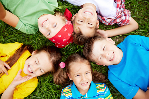 Children On Grass Stock Photo - Download Image Now - iStock