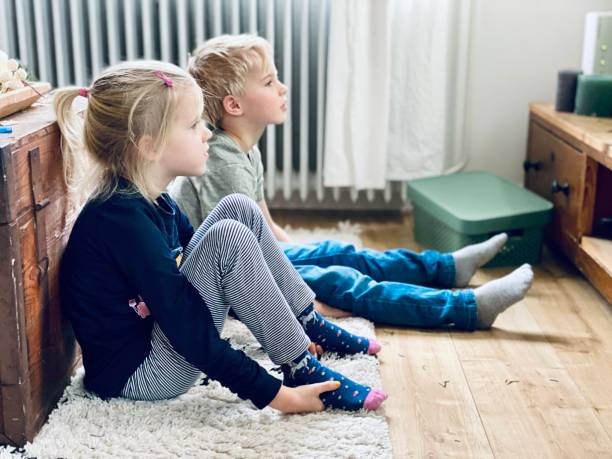 Children watching tv stock photo