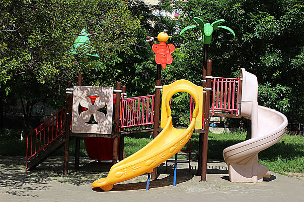 Children's playground with climbing frame and slide stock photo