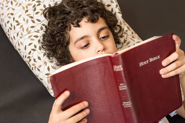 Child's Daily Christian Devotional at Home stock photo