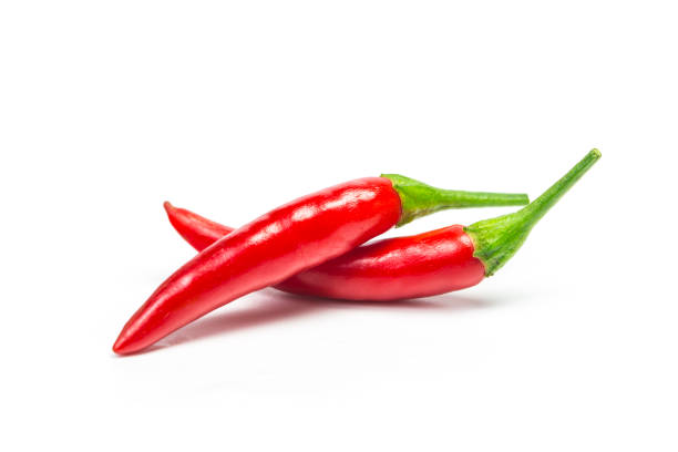 chili pepper isolated chili pepper isolated in cayenne pepper stock pictures, royalty-free photos & images