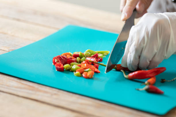 Chili peppers chopping stock photo