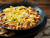 Chili with Kidney Beans, Avocado Sour Cream, Cheddar Cheese, Green Onions and Corn Chips