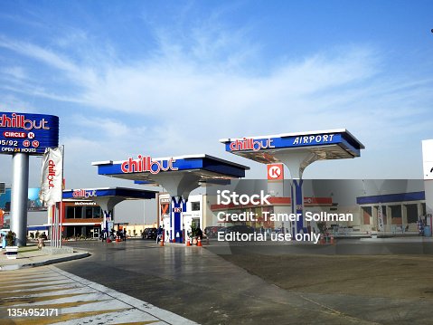 istock Chillout gas and oil station with a blue cloudy sky, a petrol gas station near Cairo airport with circle K stores and McDonald's inside the station 1354952171