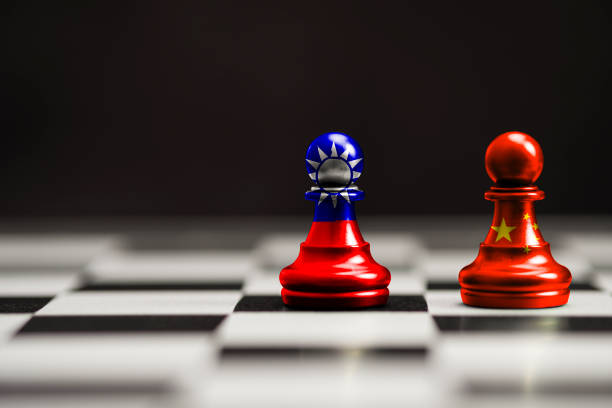 China and Taiwan flag print screen on pawn chess with black background. Now both countries have economic and patriotic conflict.  taiwan stock pictures, royalty-free photos & images