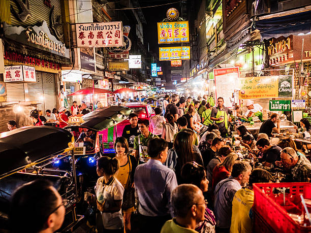 Chinatown Bangkok Thailand Crowd walking on Yaowarat Road Chinatown Bangkok. All the area is very popular at night because of the excellent street food chinatown stock pictures, royalty-free photos & images