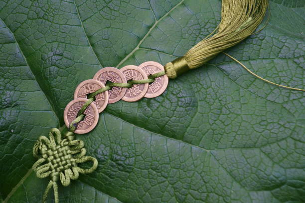 Chinese feng shui coins on a green background. Chinese feng shui coins on a green background. chinese lucky coins stock pictures, royalty-free photos & images