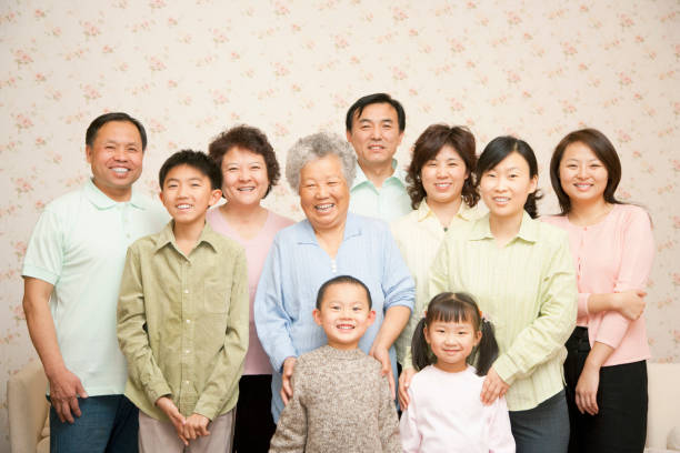Chinese multigenerational family portrait at home Chinese multigenerational family portrait at home chinese ethnicity photos stock pictures, royalty-free photos & images