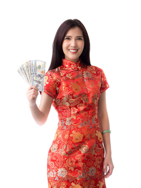Chinese new year asian woman concept, isolated asian woman wearing red dress(cheongsam) holding dollar money Chinese new year asian woman concept, isolated asian woman wearing red dress(cheongsam) holding dollar money quan yuan stock pictures, royalty-free photos & images