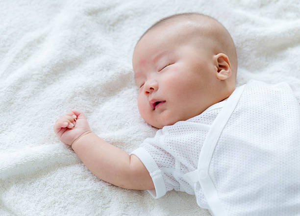 Chinese newborn sleeping stock photo