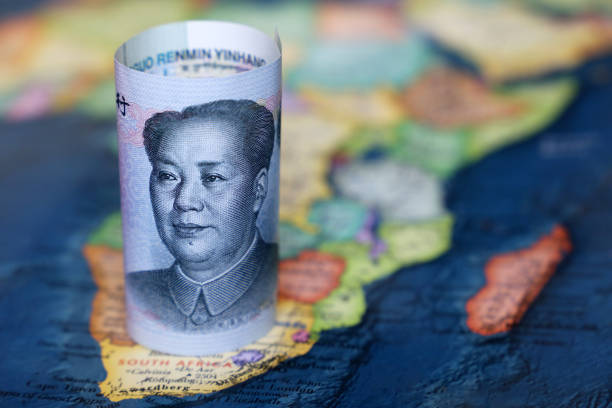 Chinese yuan on the map of Africa continent Trading between China and african countries, tourism, economy and investment bond market  stock pictures, royalty-free photos & images