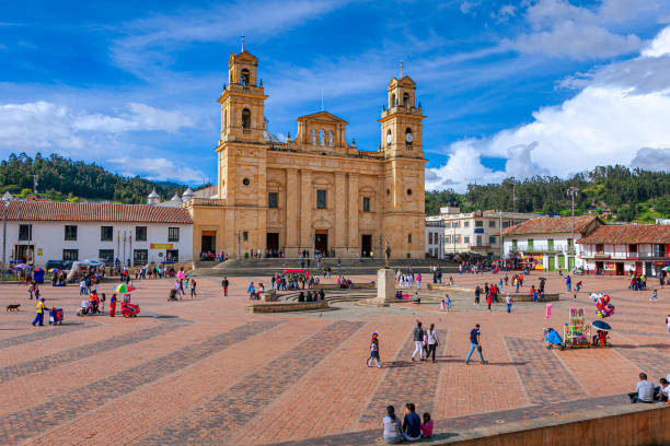 Chiquinquirá, Boyacá Department, Colombia - Local Colombians On The Main Town Square On A Sunday Afternoon; Background: Basilica Of Our Lady Of The Rosary stock photo