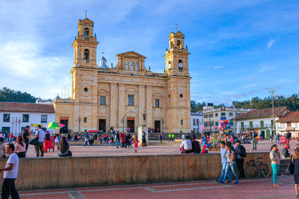 Chiquinquirá, Boyacá Department, Colombia - Local Colombians On The Main Town Square On A Sunday Afternoon; Background: Basilica Of Our Lady Of The Rosary stock photo