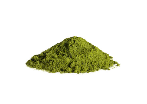 Chlorella powder heap isolated on a white background. Spirulina algae or barley dry powder. Natural food additive. stock photo