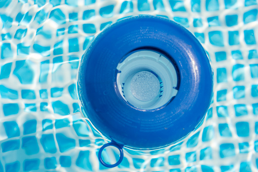 Chlorine Tablet In A Dosing Float In A Pool Stock Photo - Download Image Now - iStock