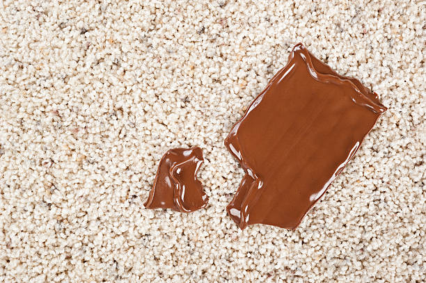 Chocolate bar dropped on carpet stock photo