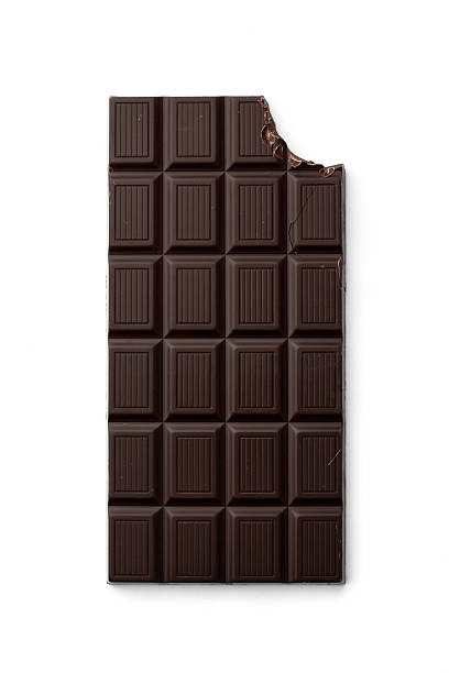 Chocolate bar with bite taken from top right corner dark chocolate bar with missing bite eaten stock pictures, royalty-free photos & images