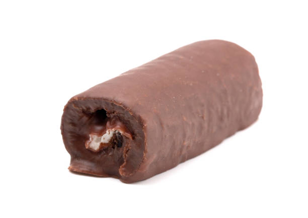 Chocolate Cake Roll on a White Background Chocolate Cake Roll on a White Background semi sweet chocolate stock pictures, royalty-free photos & images