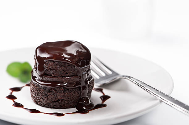 Chocolate cake with melted chocolate on top stock photo
