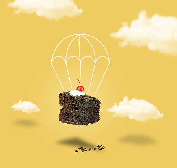 chocolate cherry cake with parachute on yellow sky without text - chocoletter stockfoto's en -beelden