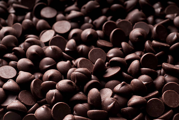 Chocolate Chip Background Chocolate chip background.  Please see my portfolio for other food related images. semi sweet chocolate stock pictures, royalty-free photos & images