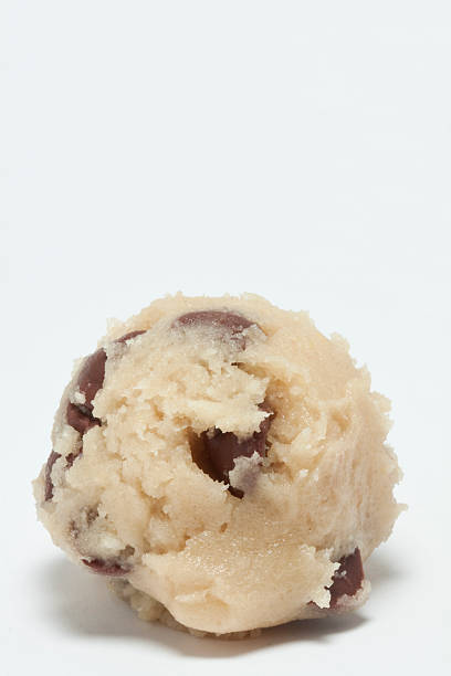 Chocolate Chip Cookie Dough A ball of raw chocolate chip cookie dough. dough stock pictures, royalty-free photos & images