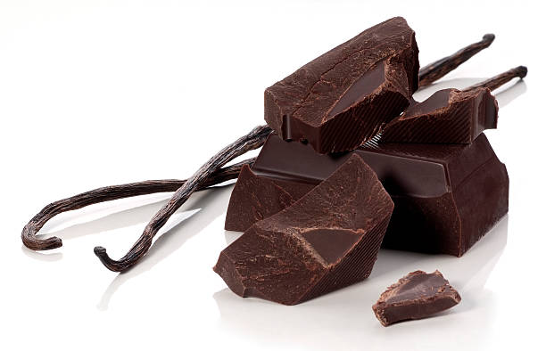 Chocolate chunks and vanilla beans stock photo