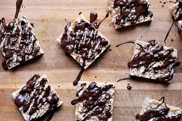 Chocolate covered rice krispies drizzled semi-sweet chocolate semi sweet chocolate stock pictures, royalty-free photos & images