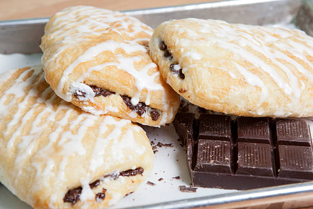 Chocolate croissants with icing stock photo