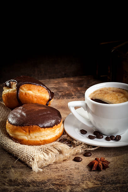 Chocolate Donut with coffee on wooden background stock photo