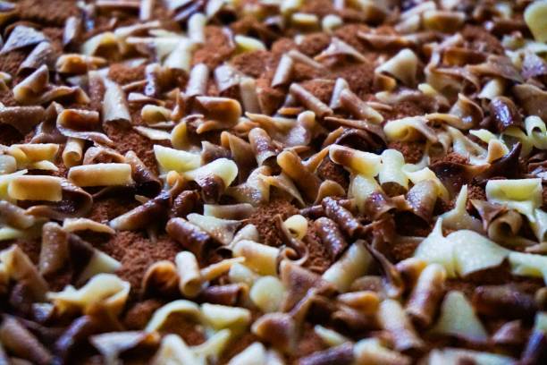 Chocolate flakes tiramisu top macro closeup stock photo