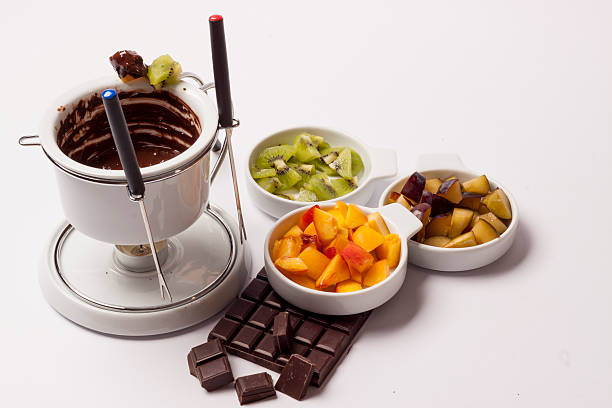 Chocolate fondue on white background stock photo