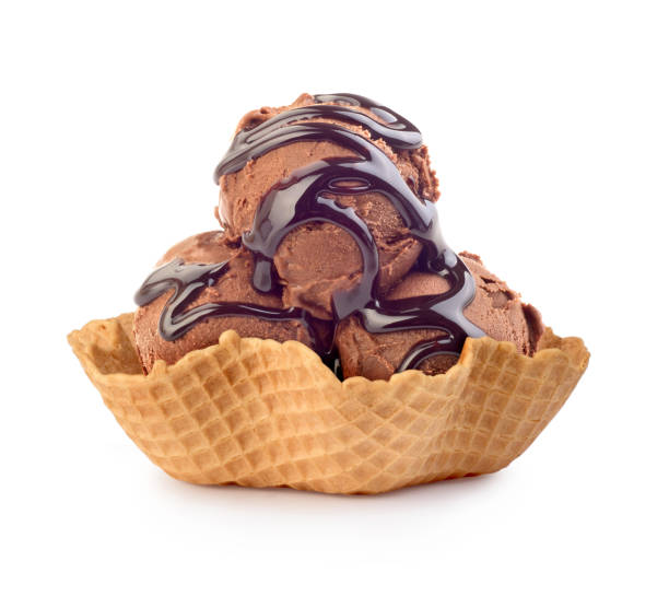 chocolate ice cream in a waffle basket chocolate ice cream in a waffle basket dessert topping stock pictures, royalty-free photos & images