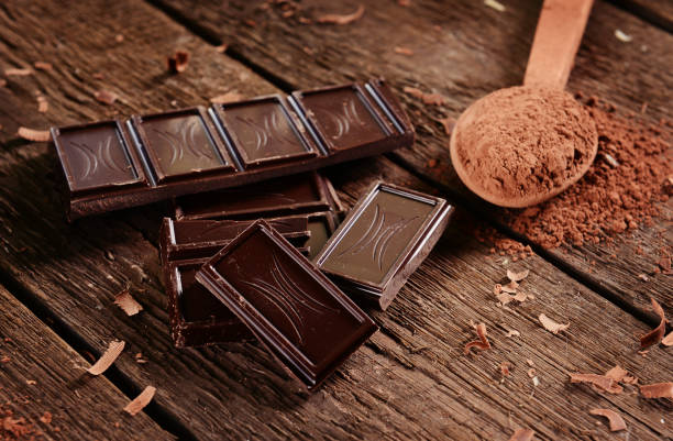 Chocolate Chocolate on wooden background dark chocolate stock pictures, royalty-free photos & images
