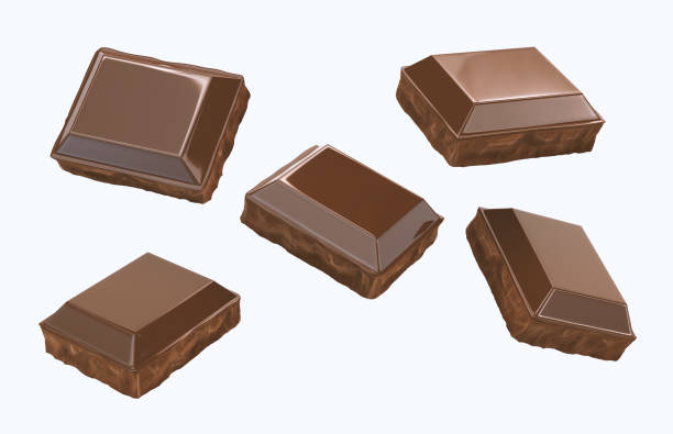 chocolate Pieces flying isolated on white background. stock photo
