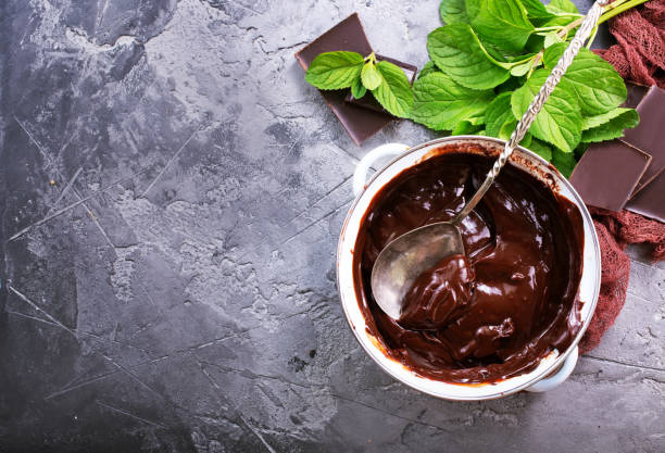 chocolate sauce chocolate cream in bowl and on a table semi sweet chocolate stock pictures, royalty-free photos & images