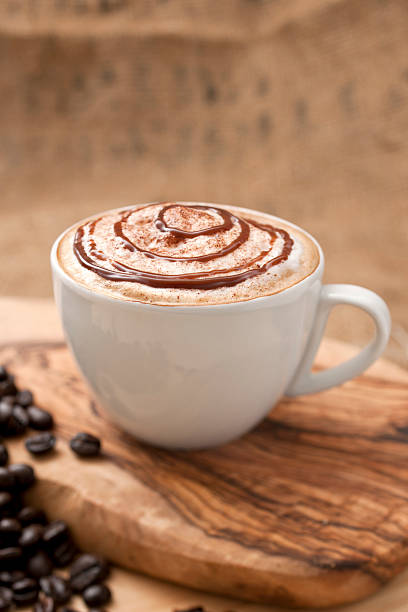 chocolate topped coffee - caffè mocha stockfoto's en -beelden