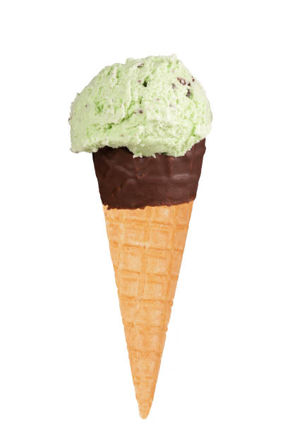Chocolate-dipped ice cream cone with mint choc chip ice cream stock photo