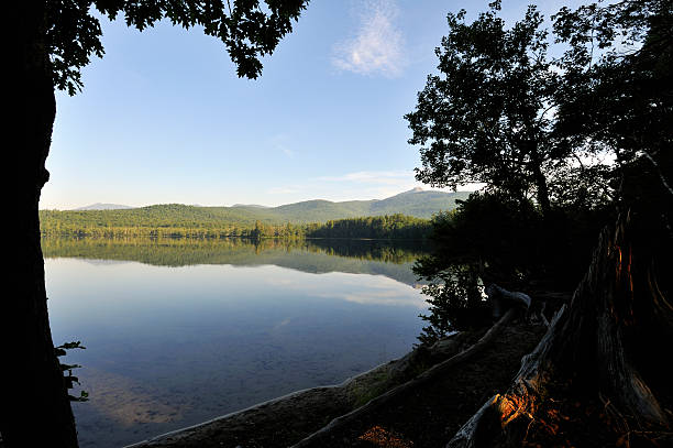 Chocorua Morning Shore with Background Mountain "The well known and much loved Lake Chocorua with the heavily climbed Mount Chocorua in the background. Both are located in Tamworth NH, which, by way of route 16, is" mike cherim stock pictures, royalty-free photos & images