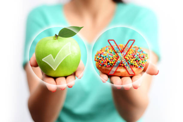 Choose or decide to have a healthy lifestyle concept, eating fresh food instead unhealthy nutrition stock photo
