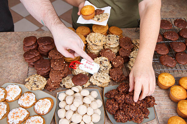 Choosing Cookies At A Bake Sale stock photo