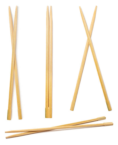 Chopsticks Set of chinese bamboo chopsticks isolated on white background chopsticks stock pictures, royalty-free photos & images