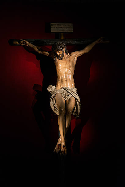 Christ on the cross in Seville Figure of Christ crucified as sculpted by Juan Martinez Montañes in 1603 in polychromed wood, hosted in the chapel of San Andres in Seville's Cathedral. seville cathedral stock pictures, royalty-free photos & images
