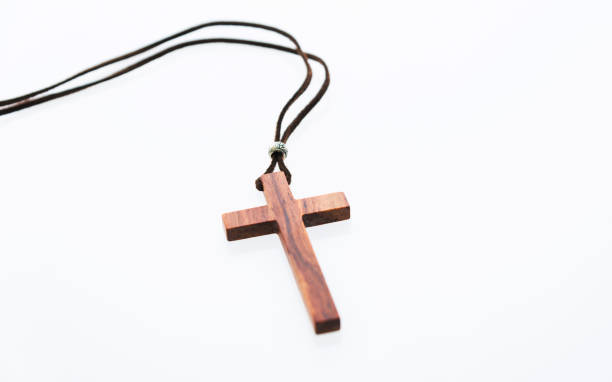 Christian cross necklace on white background  cross necklace stock pictures, royalty-free photos & images