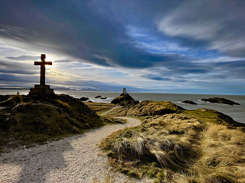 A beautiful view on Llanddwyn Island near Newborough Beach, Anglesey, with the symbol of the Christian Cross.